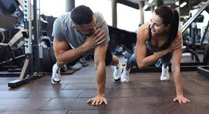 Toning Bingo Wings: Your Ultimate Guide to Sculpting Sleek Arms at the Gym 3 Fitness trainer demonstrating arm toning exercises Canvey Island