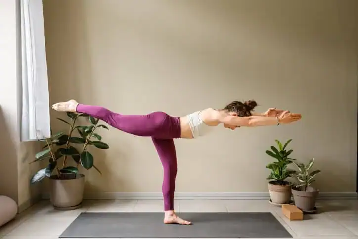 Achieving the Perfect Tone: How Often Should You Exercise for Results? 1 Woman doing Yoga exercise Canvey Island to help with toning the body.