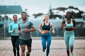 Sculpting Sleek Arms: The Essential Role of Cardio in Toning Without Bulking Up 3 image of people running to incorporate cardio Canvey Island exercise into their life to help tone arms and body.